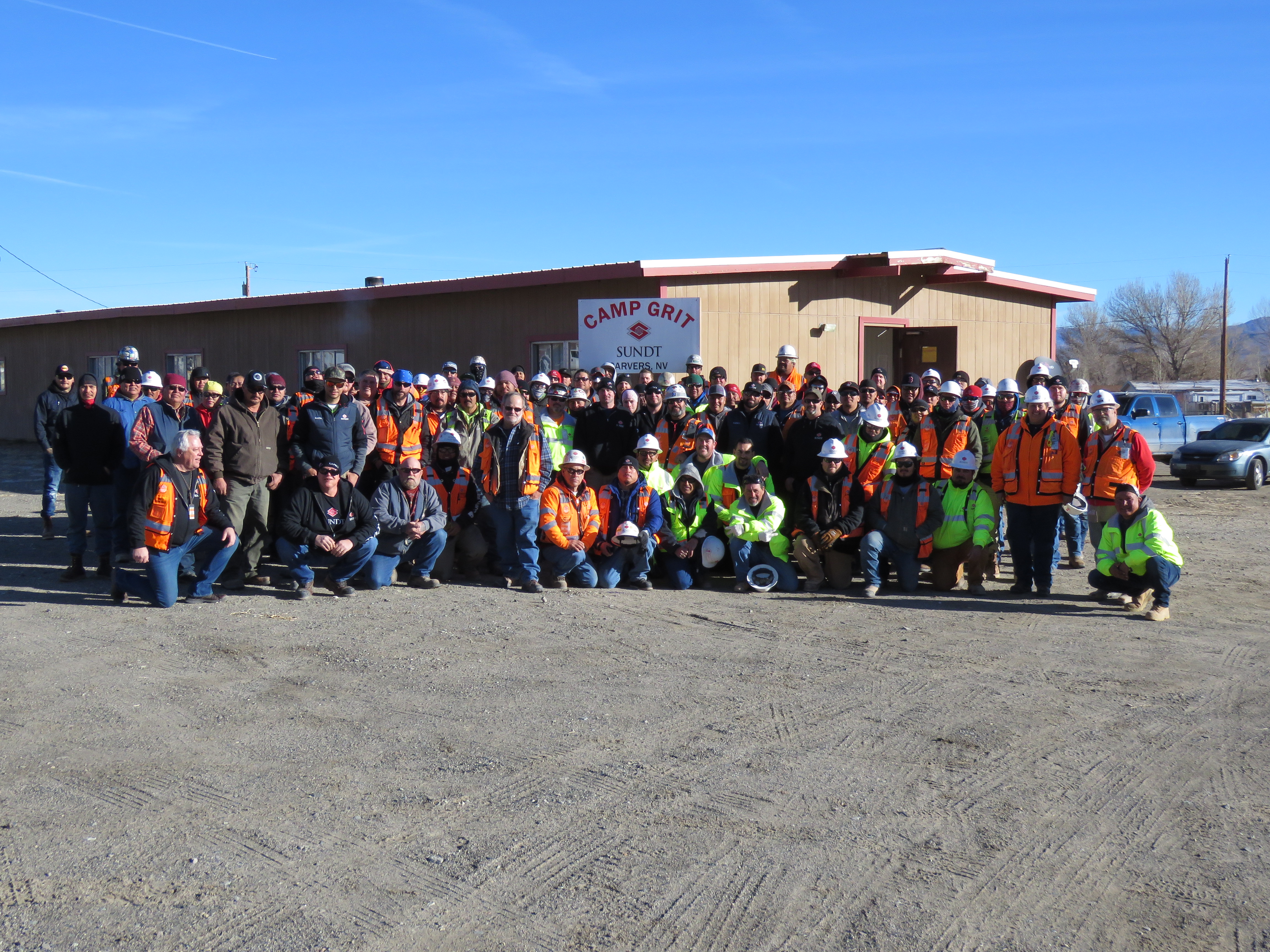 The Sundt Round Mountain Project Team poses for a photo in front of 
