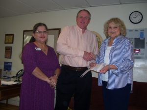 Sundt Foundation representative Randy Rusing delivered a check to St. Luke’s Home in Tucson, Ariz.