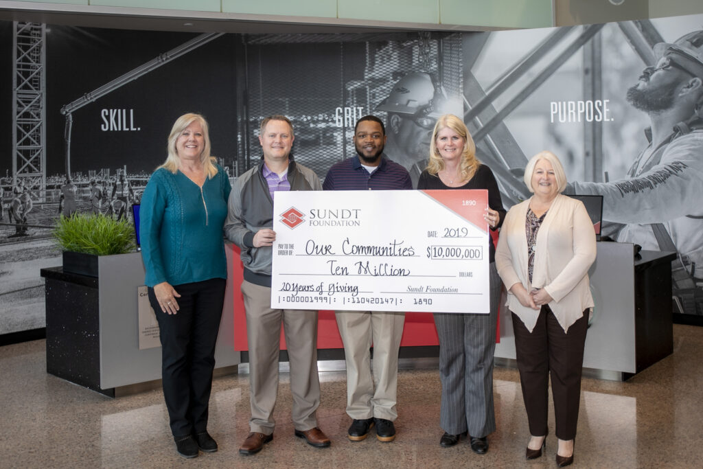 Sundt Foundation members pose with a commemorative check for $10 million 