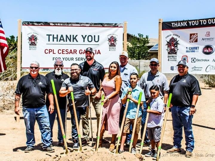 Cesar alongside his family, coworkers, and former NFL Player Jared Allen and his Homes for Wounded Warriors Foundation