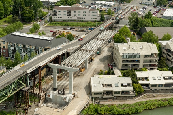 The team is building the replacement bridge in a constricted space. The original structure was moved to the side using a shoofly so traffic impacts are minimized.