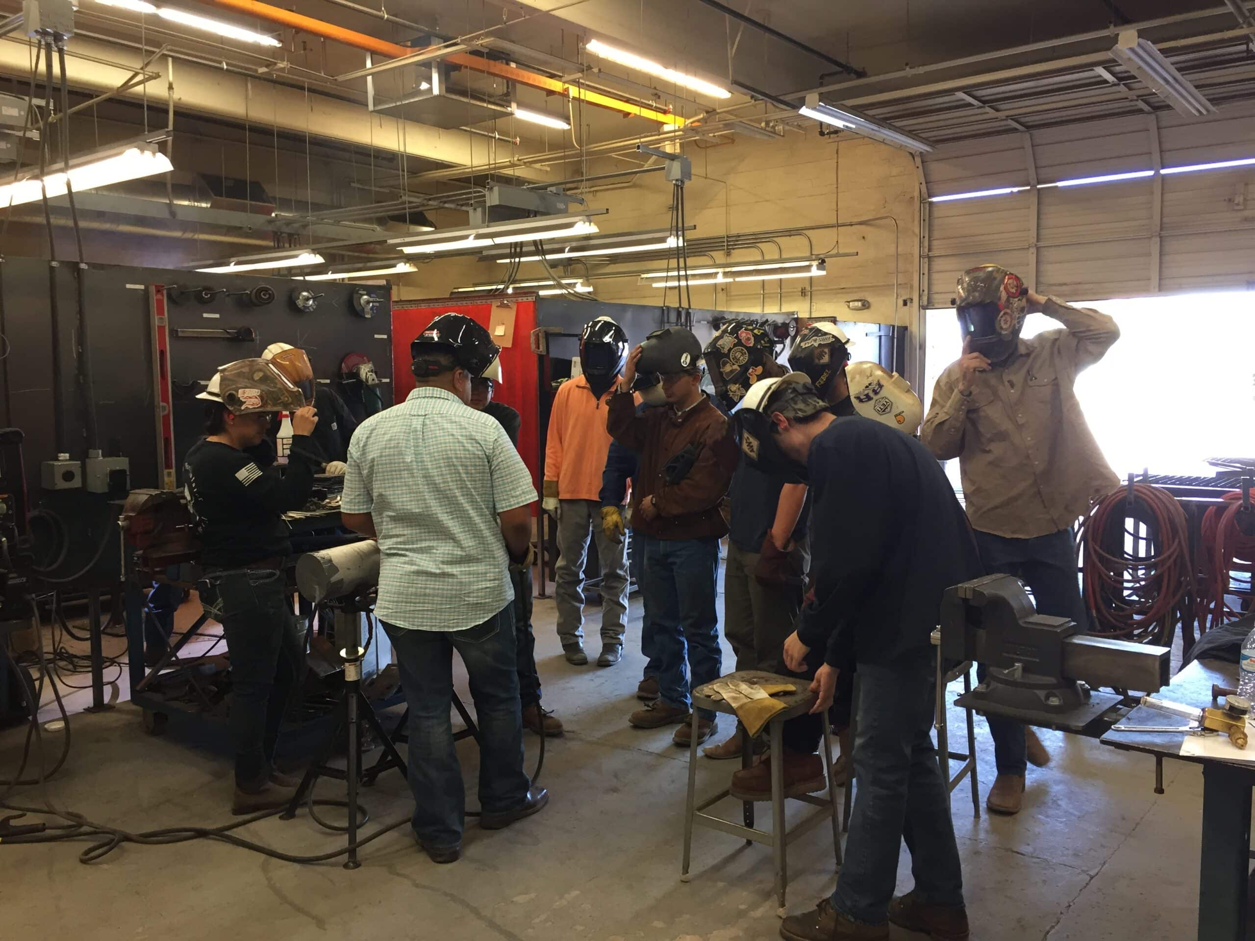 Josué teaching welding students at Central Arizona College