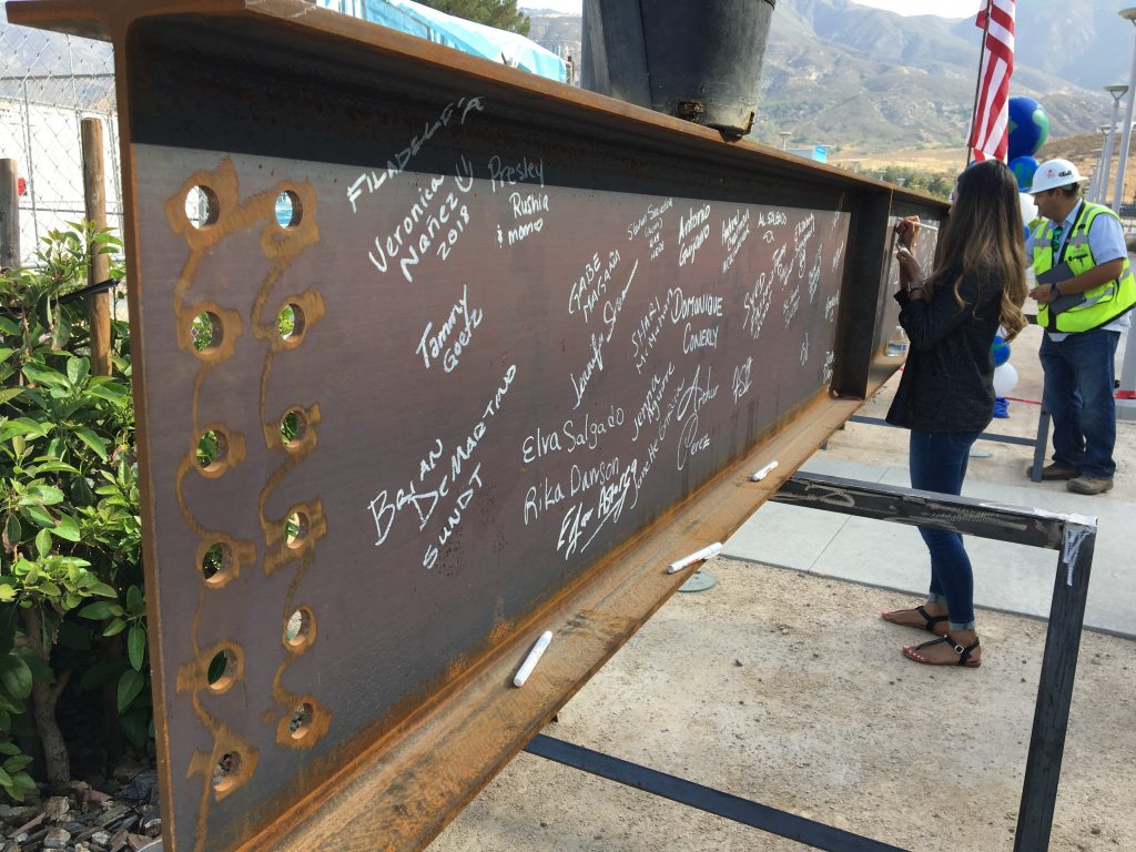 CSUSB staff and Sundt employee-owners sign beam to be placed atop the Center for Global Innovation