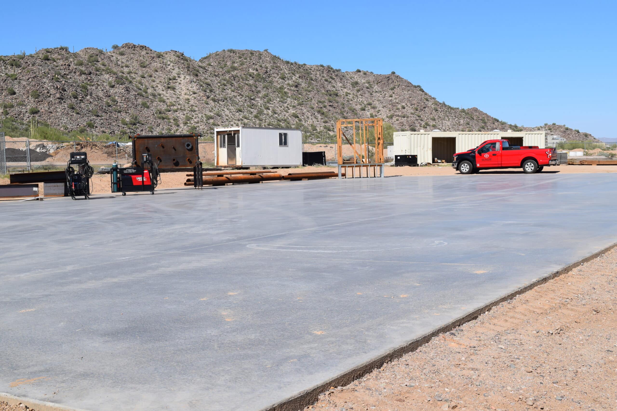 During the ceremony, the program’s training equipment and tools were placed on display across the concrete pad.   