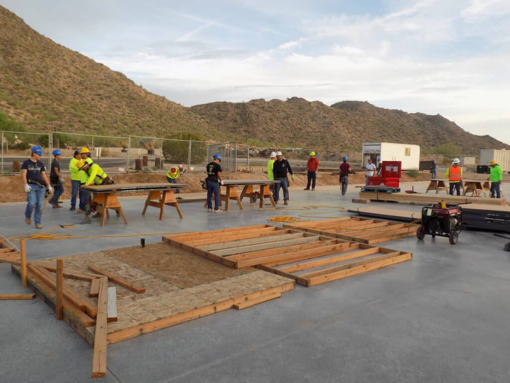 Students from Casa Grande Union High School's CTE program were grouped together in teams to learn how to properly frame a wall