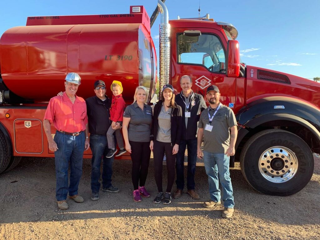 Sundt's Big Dig Committee Members and Safety Experts stand in front of Sundt truck