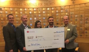 sundt foundation presents a check for 10,000 dollars to Shriners hospital