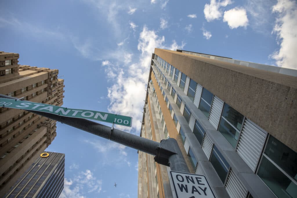 view from ground level at corner of stanton street looking up to top of blue flame building in downtown El Paso.