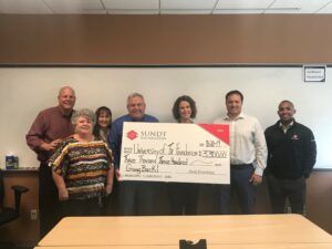 sundt foundation presents a check to the university of texas foundation