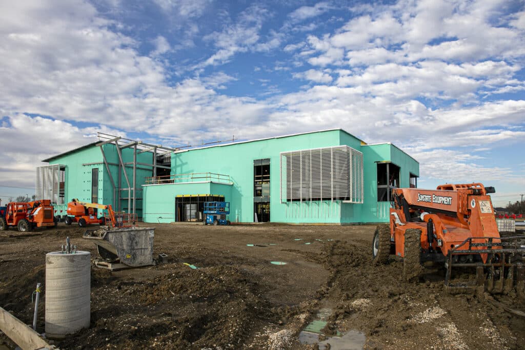 Front entrance of under-construction, two-story The Beacon Rec Center in Arlington Texas