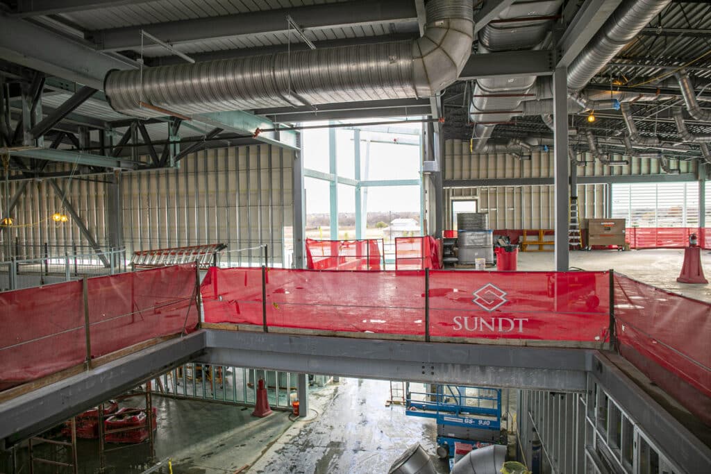 interior shot of under-construction, two-story arlington rec center showing mezzanine level view