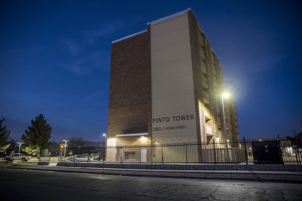 night-time exterior of renovated Father Pinto High-Rise tower for Housing Authority of El Paso