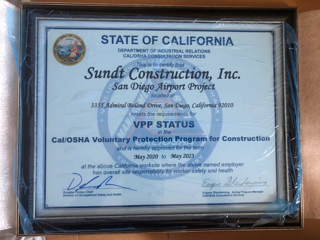 new cal/OSHA VPP Status plaque with blue plastic wrap