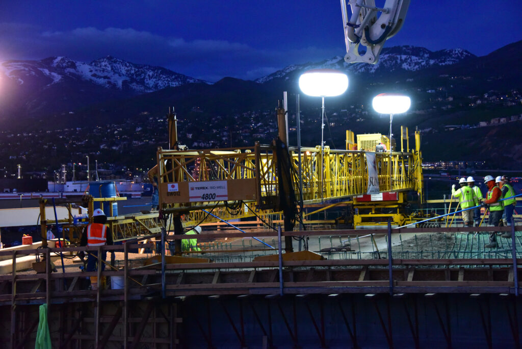 Crew completes a night-time pour on the Redwood Road bridge over I-215