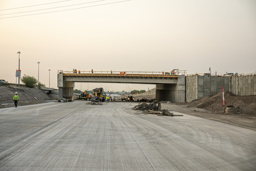 I-10 Ruthrauff intertchange project with new expanded freeway under construction leading up to new bridge under construction
