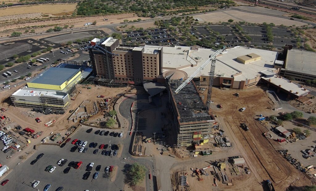 Aerial progress images show the new conference center (left) and pool areas (center-left), as well as the in-progress 205-room tower (center-right) adjacent to the existing Gila River Hotels & Casinos- Wild Horse Pass, which is currently open to guests. 