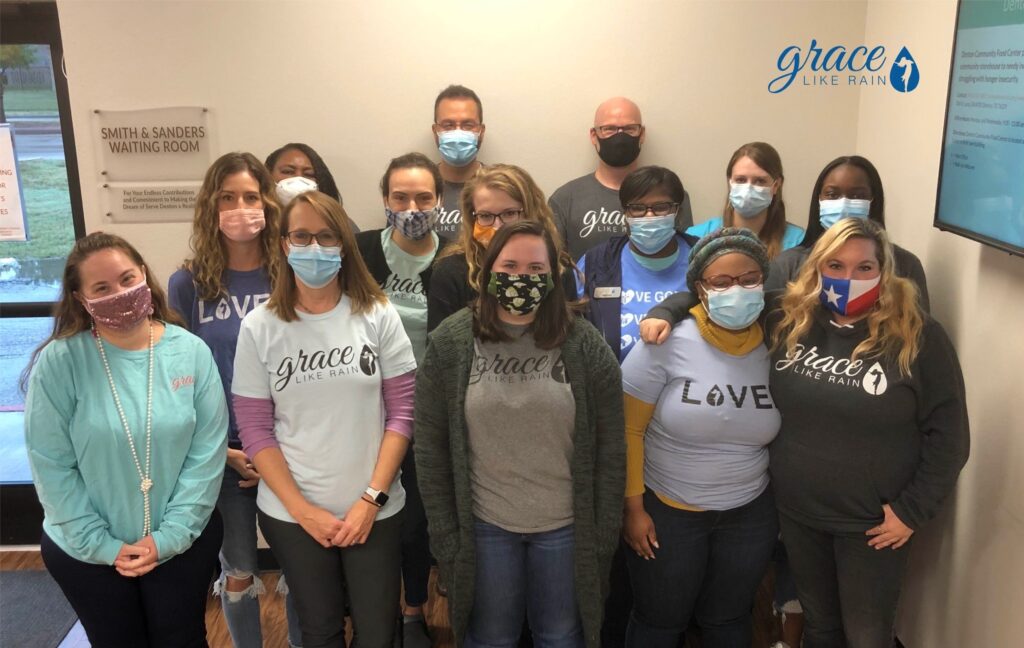 14 grace like rain staff members pose together in face masks 