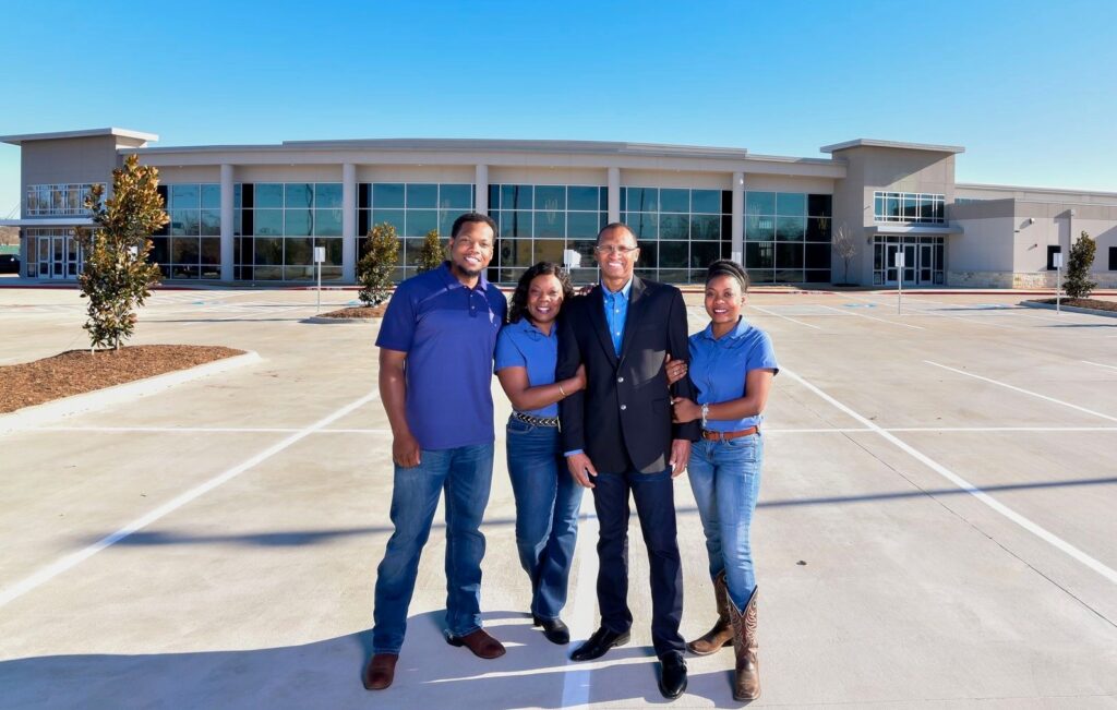 York Builders Family stands in front of completed 34,000-sf church project