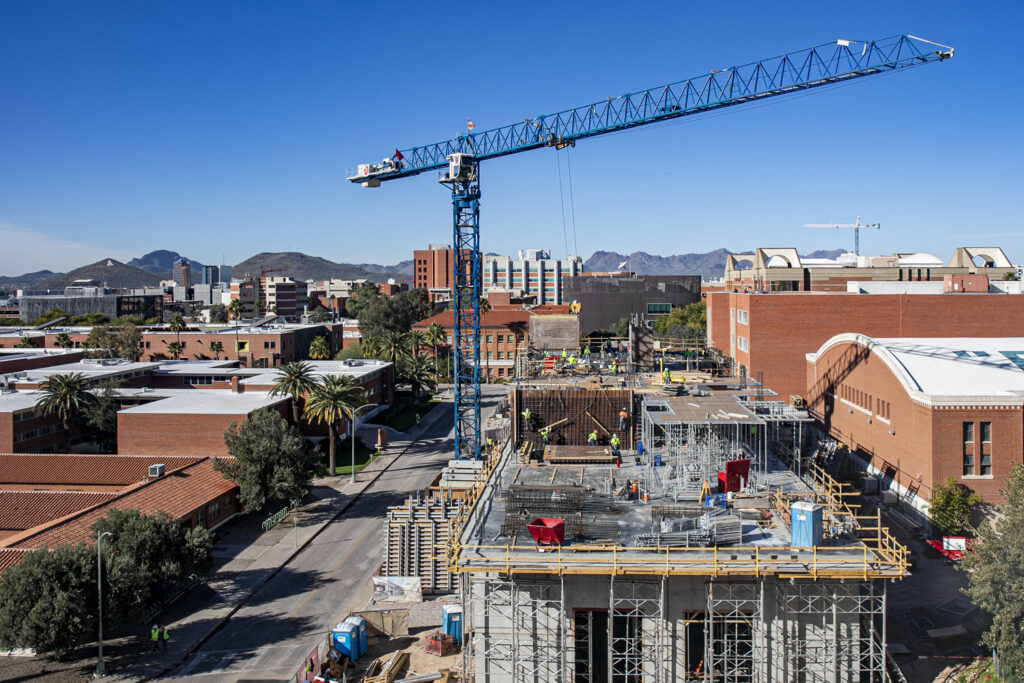 Looking westward at the in-progress Student Success Building in early 2020, with the historic Bear Down Gym and Albert B. Weaver Science-Engineering Library to the north.