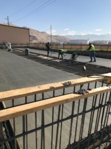 concrete finishers work on slab on grade