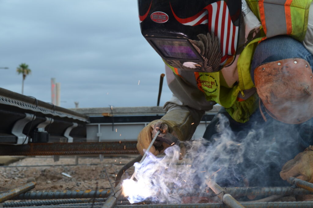 A Sundt welder working on a light rail project