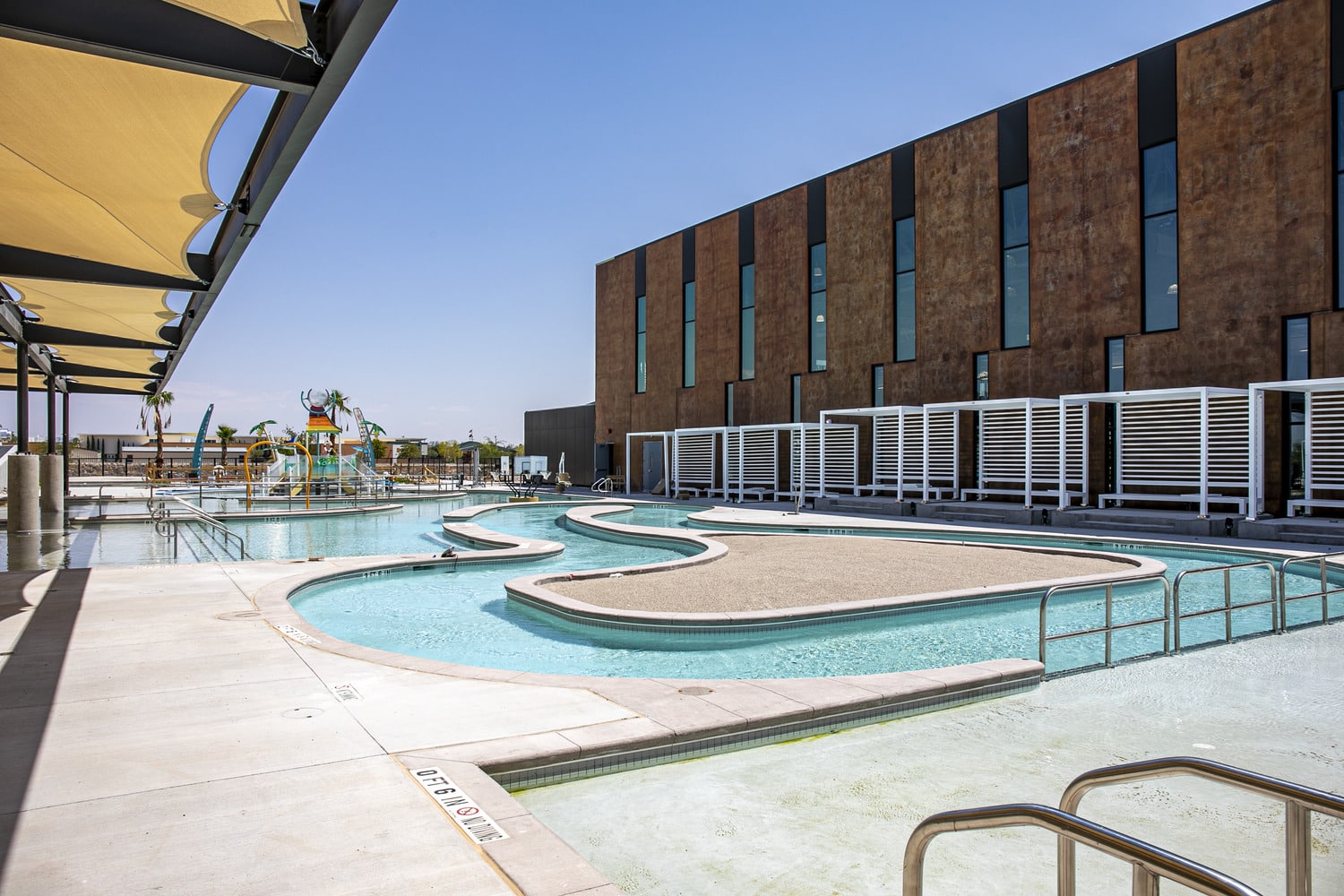 out door lazy river at beast urban park with gym in background