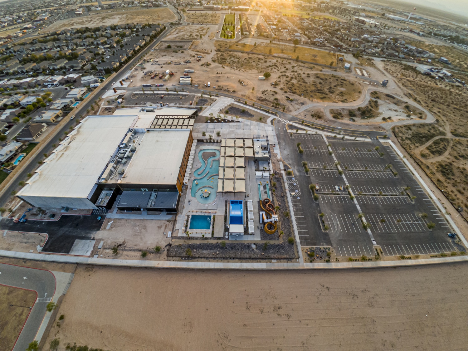 Aerial view of Beast Urban Park Phase 1 showing natatorium, community center and gymnasium, outdoor waterpark, and parking lot/walking trails