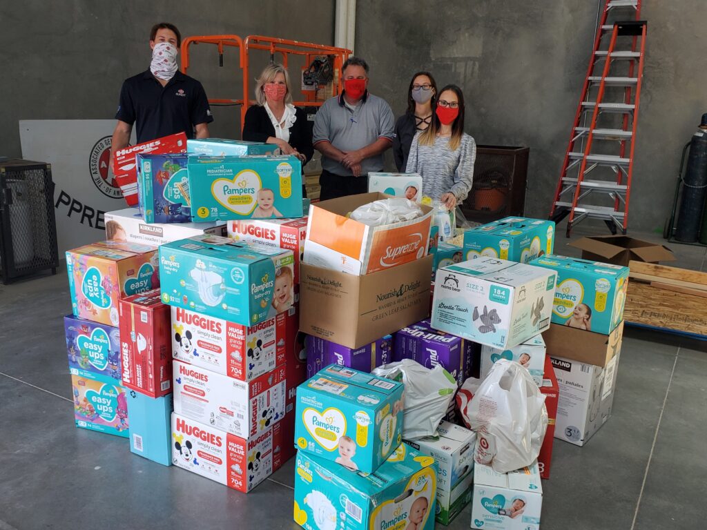 Sundt Foundation members unload supplies at the Support the Enlisted Project (STEP) annual baby drive 