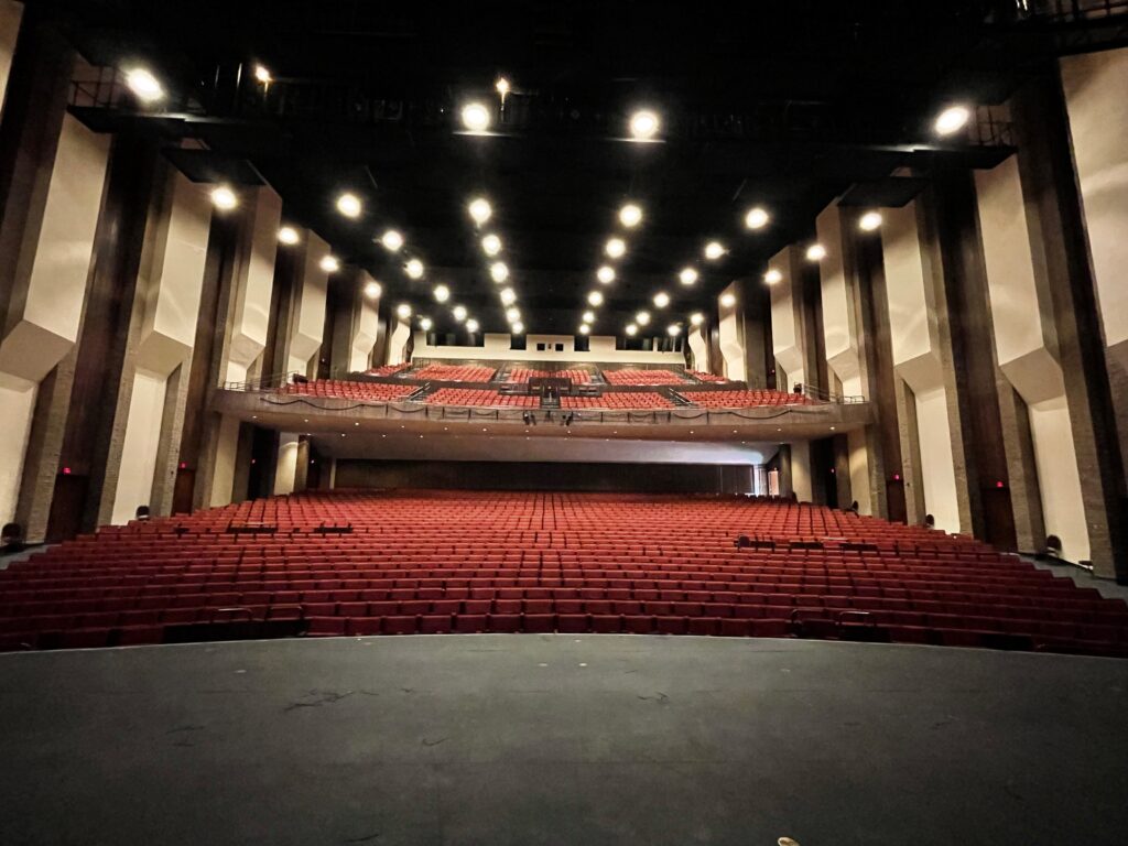 large empty music hall viewed from the stage