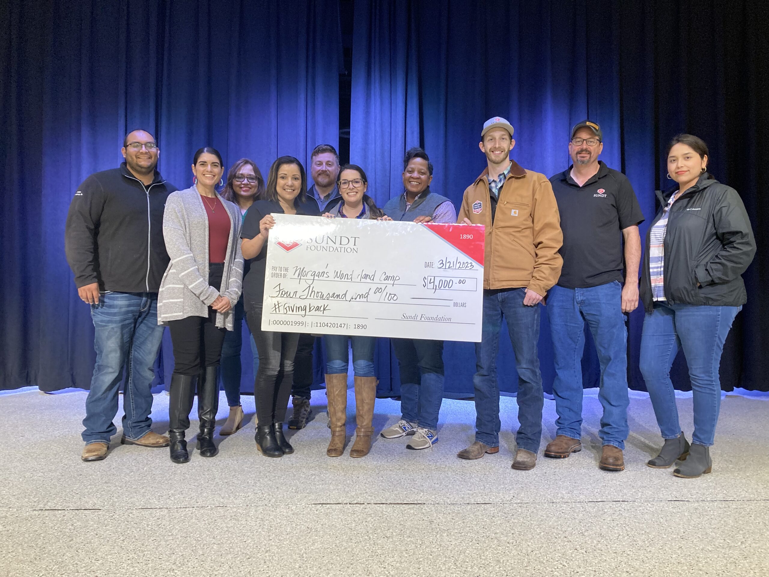 Sundt Employees give check to Morgan's Wonderland