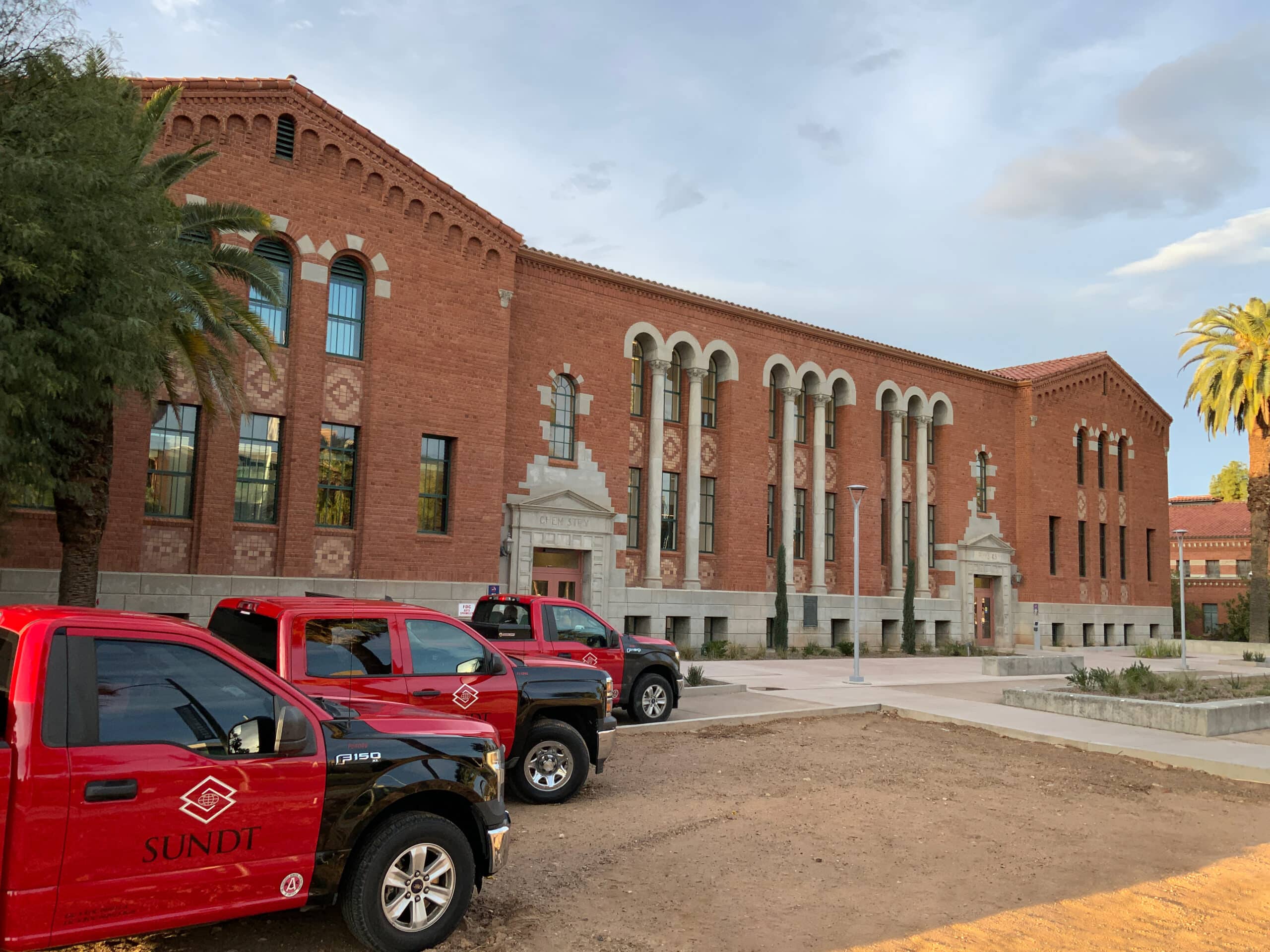 Sundt trucks parked outside in 2023 after completion of new hardscape.