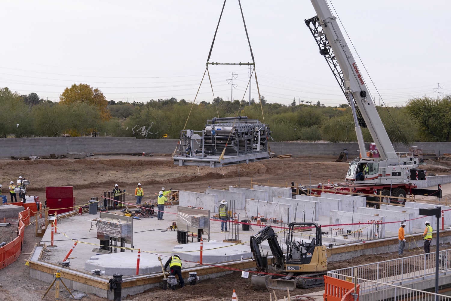 Sundt teams set one of the new belt presses in place at the site of the Town of Gilbert's North Water Treatment Plant Facility.